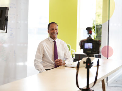 Middle aged businessman making a corporate video